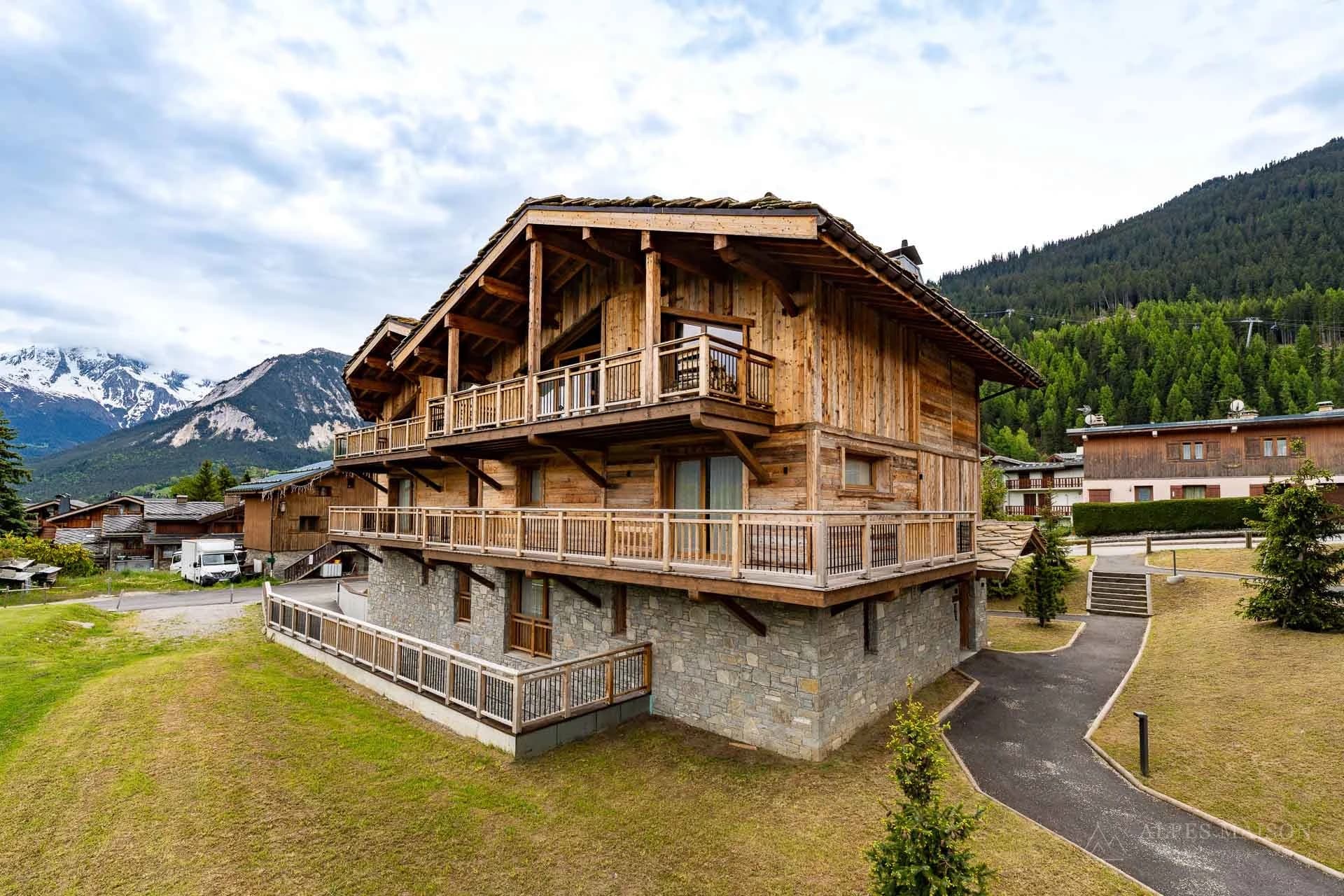 Exterior of the timber-clad Alpine building — Le Praz Chalet Prestige