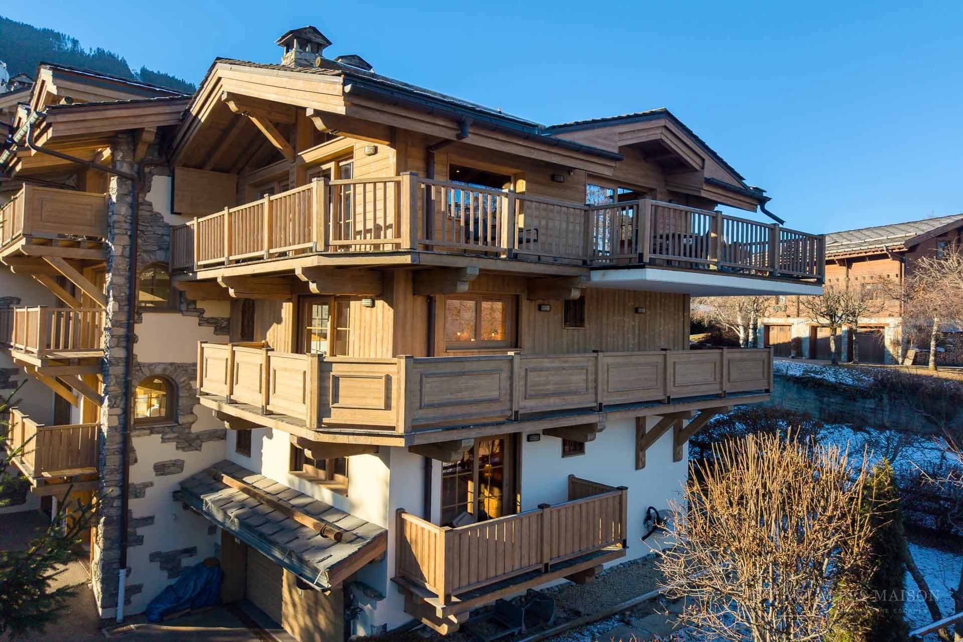 Exterior of the timber-clad Alpine building — Sommet Blanc Suite