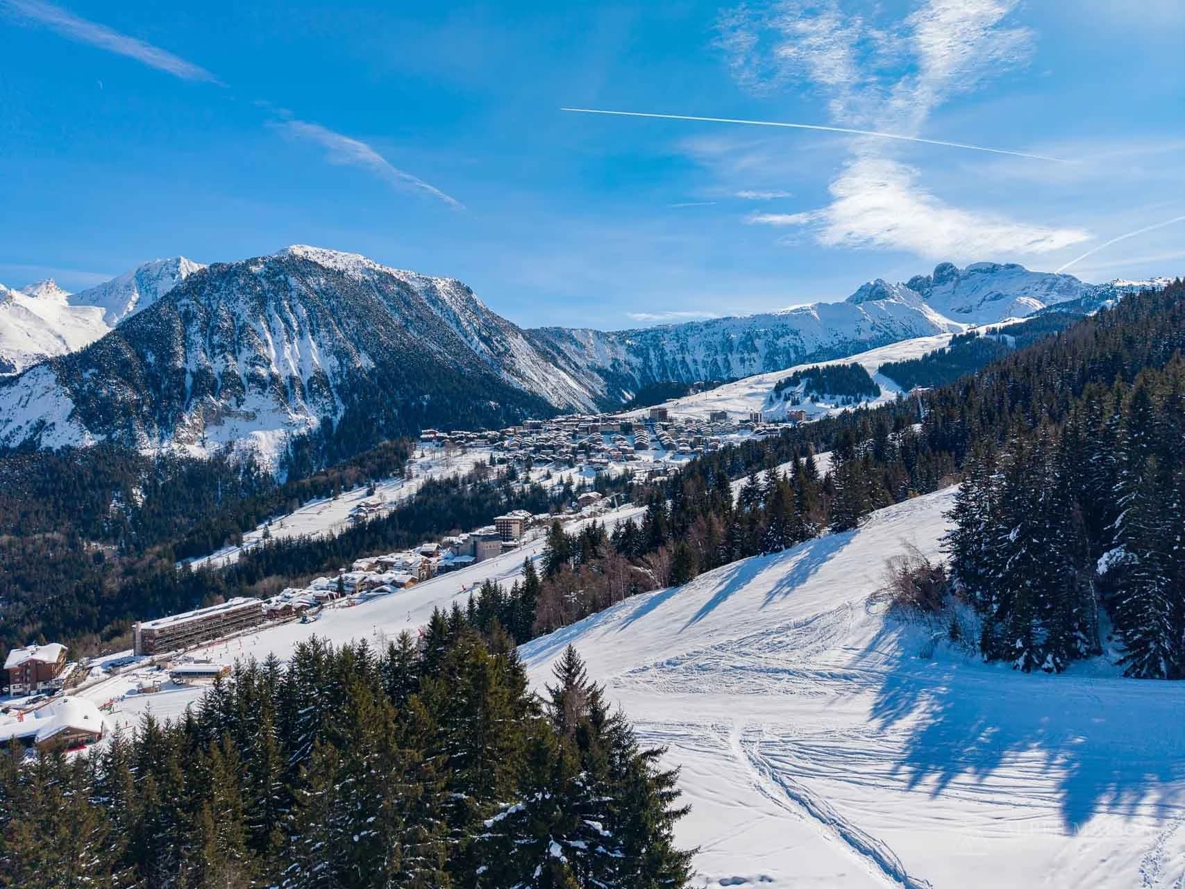 Snow-covered ski slopes and mountain landscape — Three Valleys Escape