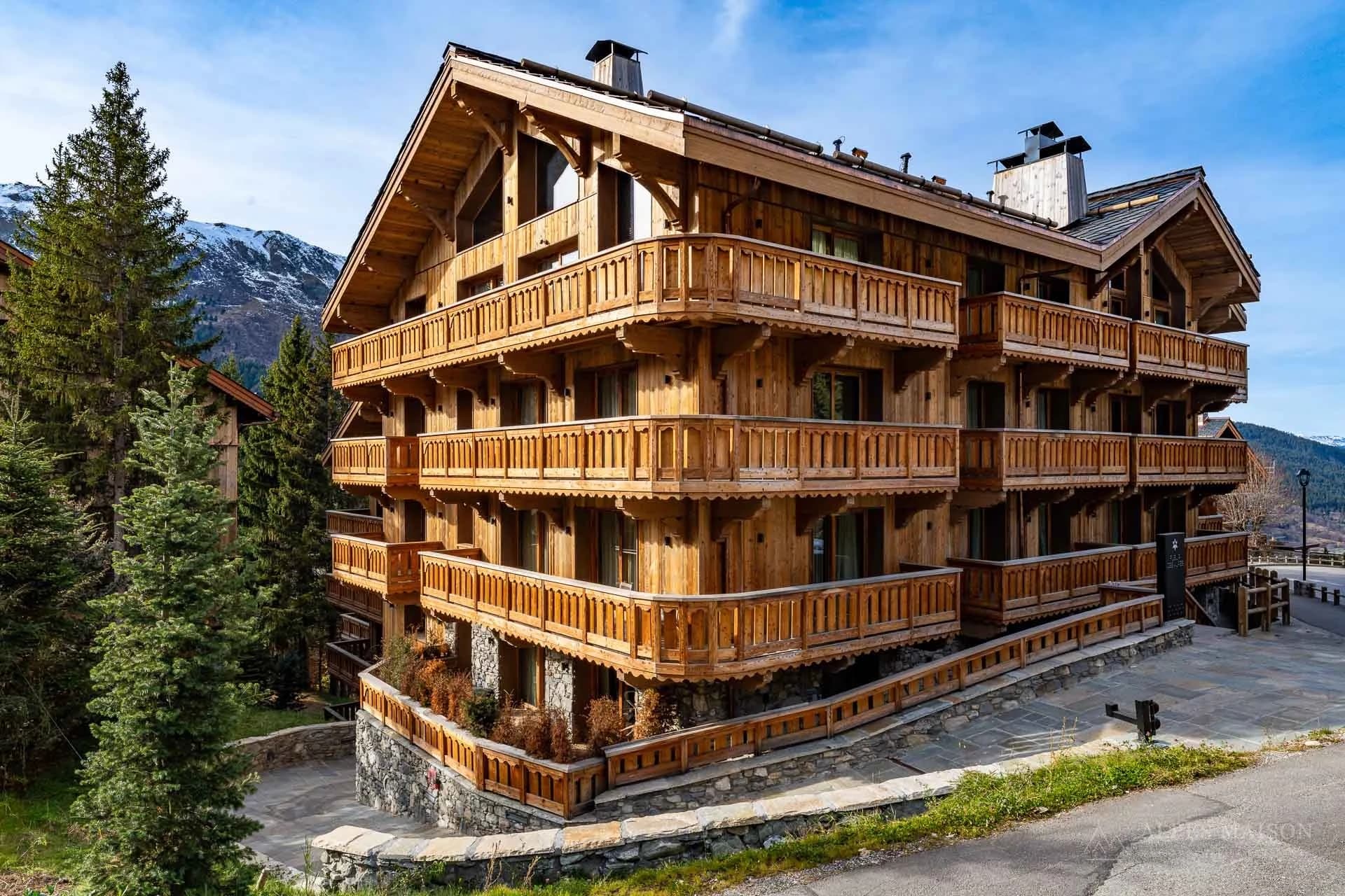 Exterior of the timber-clad Alpine building — Fleur des Alpes Residence 1
